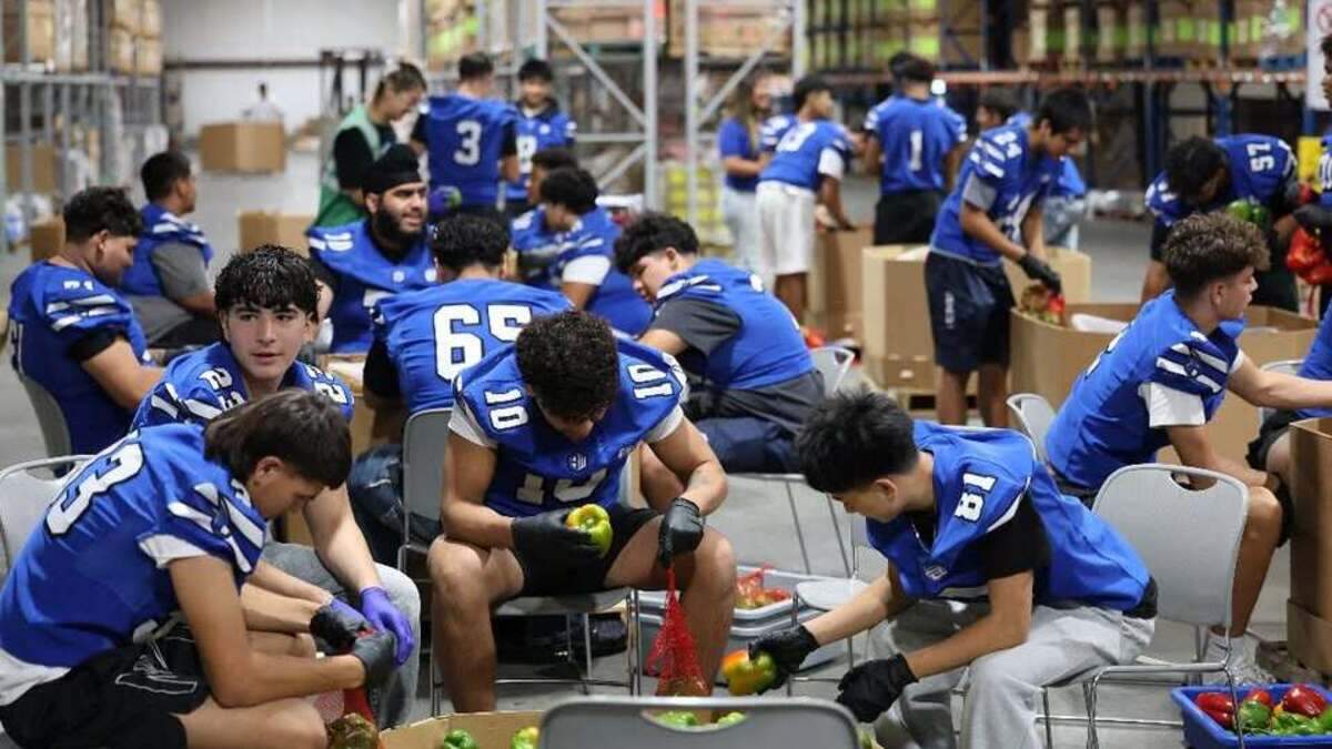 The Sanger West football players volunteer to pack bell peppers at the Central California Food Bank. The Sanger West football players volunteer to pack bell peppers at the Central California Food Bank.